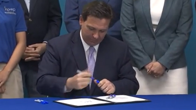 Gov.+DeSantis+signing+the+new+personal+finance+bill+on+March+22%2C+2022.+